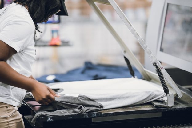 guy doing direct to garment printing